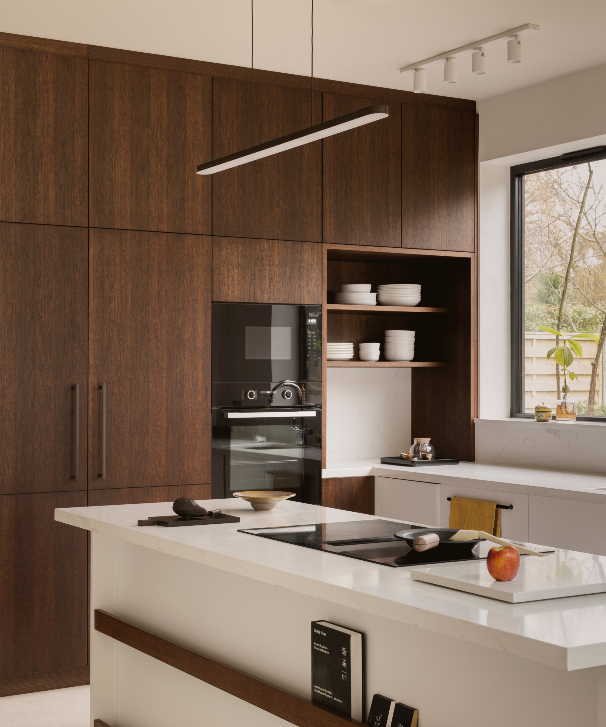 neutral kitchen with dark wood and white counters