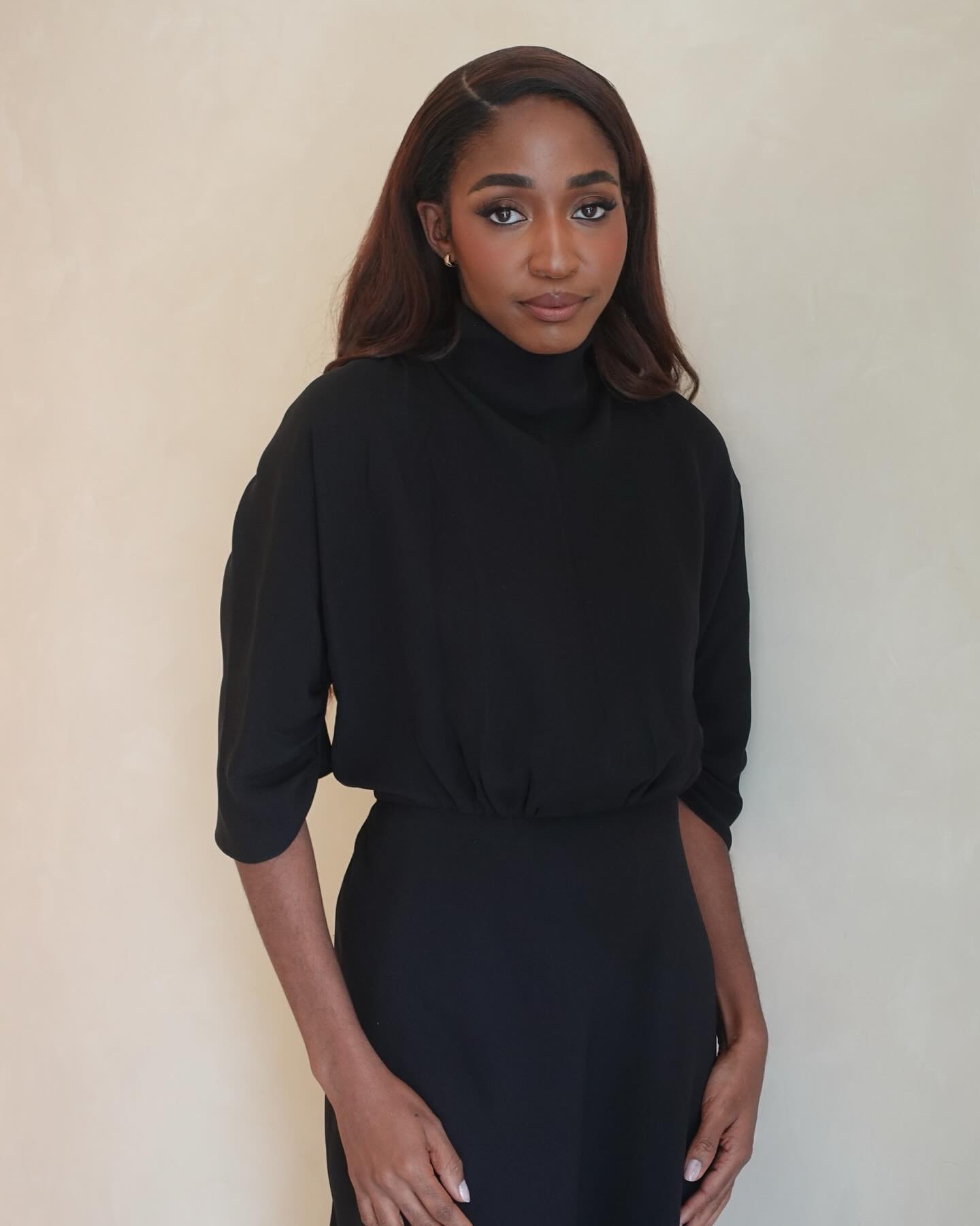 Ayo Edebiri with side parting hair