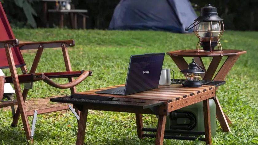 The Lenovo Yoga Solar concept laptop, on an outside table, in the sun. 