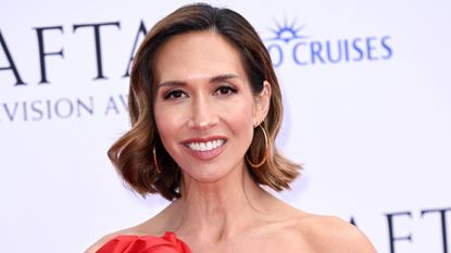 Myleene Klass is pictured wearing rosy nude lipstick and a red dress at the 2026 BAFTA Television Awards with P&O Cruises held at Royal Festival Hall on May 10, 2026 in London, England. 