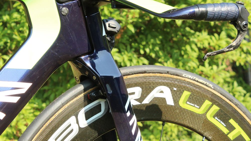 Dowsett's front brake is hidden from the wind but still somewhat accessible by hand