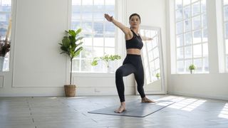 image shows woman doing a yoga pose