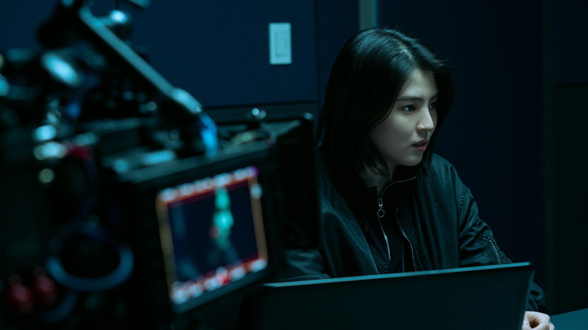 Han So-hee stars in &lsquo;My Name&rsquo;. she sits in front of a laptop in a dark room