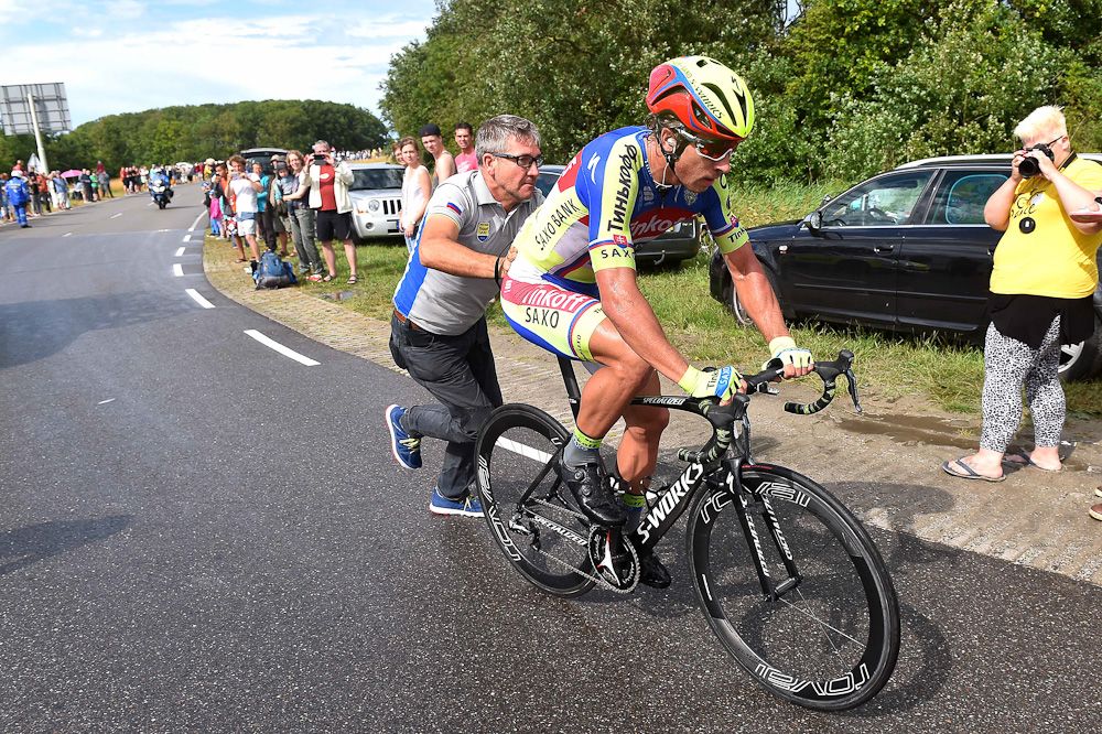 Peter Sagan gets a push after receiving a new bike.