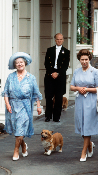 The Queen Mother, Smiling, With Her Daughter, Queen Elizabeth Ll, Outside Clarence House With Her Pet Corgi On Her 83rd Birthday