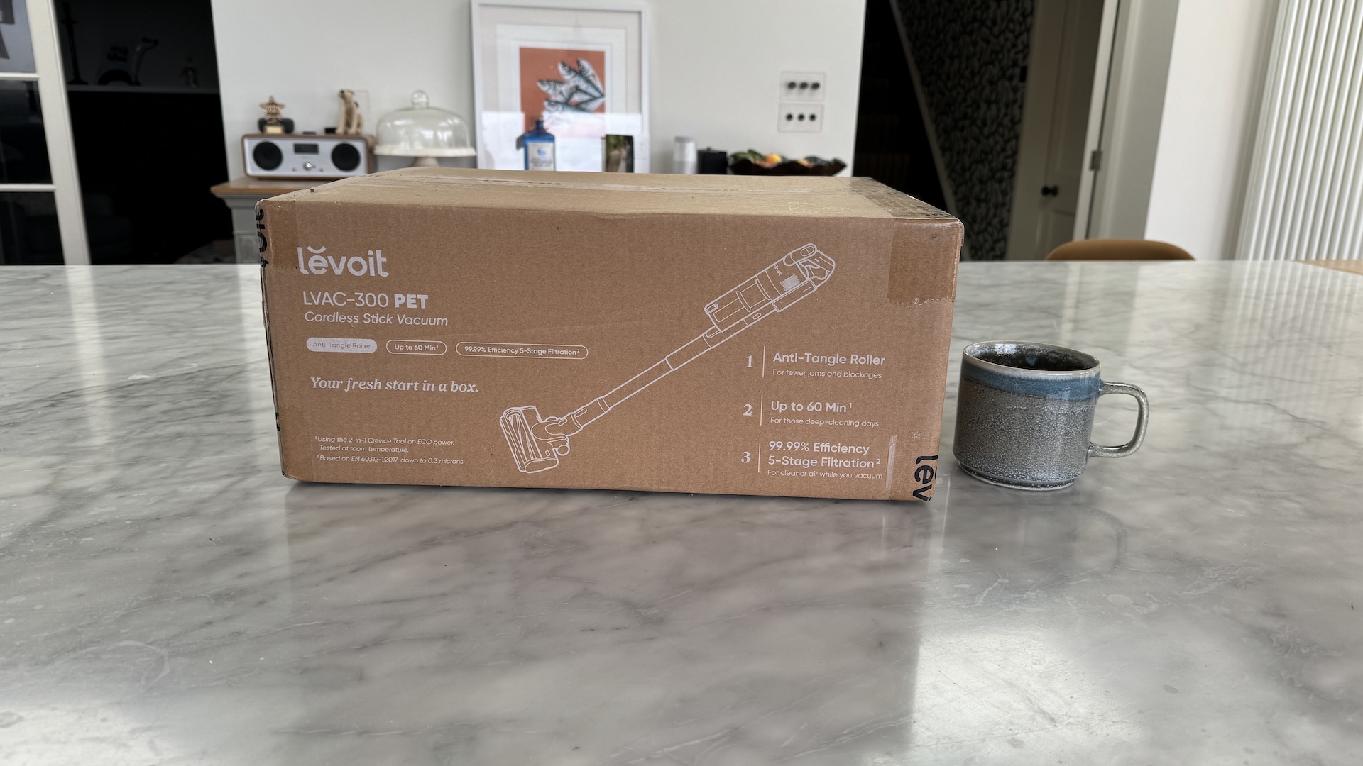 Levoit LVA-300 vacuum in box on marble counter