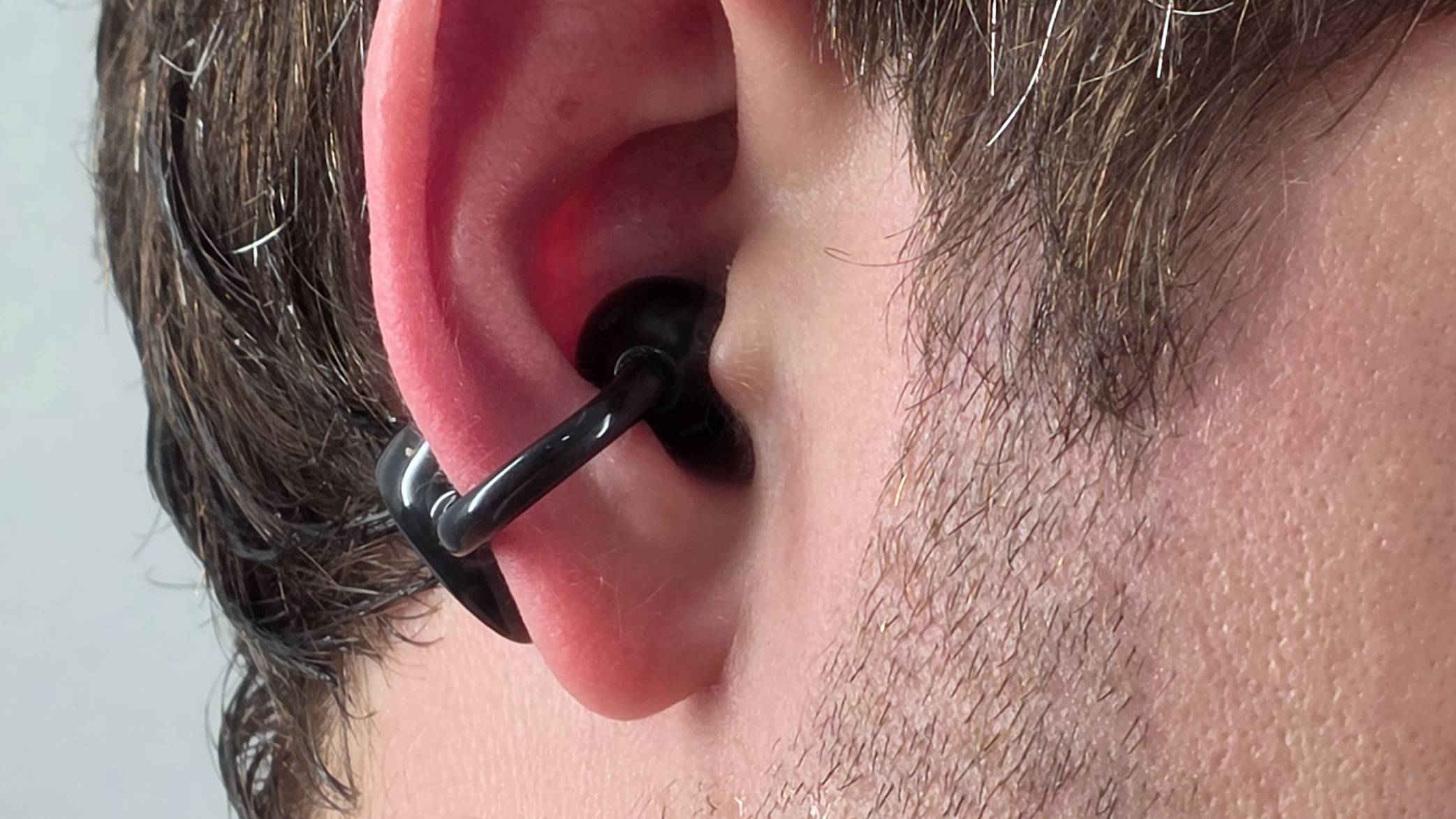 The Soundpeats Pop Clip2 in a man's ear.