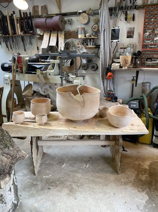 Wooden workshop table with bowls by Max Bainbridge, work in progress for One Tree Project