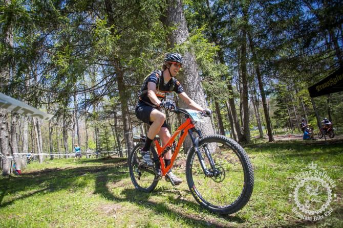 Barry Wicks riding through the camp on his way to win stage 1