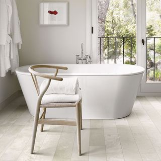 stone planks with bathtub and chair with towel