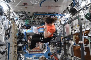 NASA astronaut Christina Koch testing her vision on board the space station.