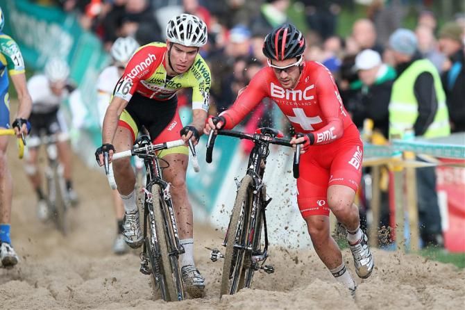 Marcel Meisen, left, and Julien Taramarcaz in the midst of the Superprestige Ruddervoorde sand pit