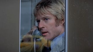 Robert Redford in a telephone booth in Three Days of the Condor