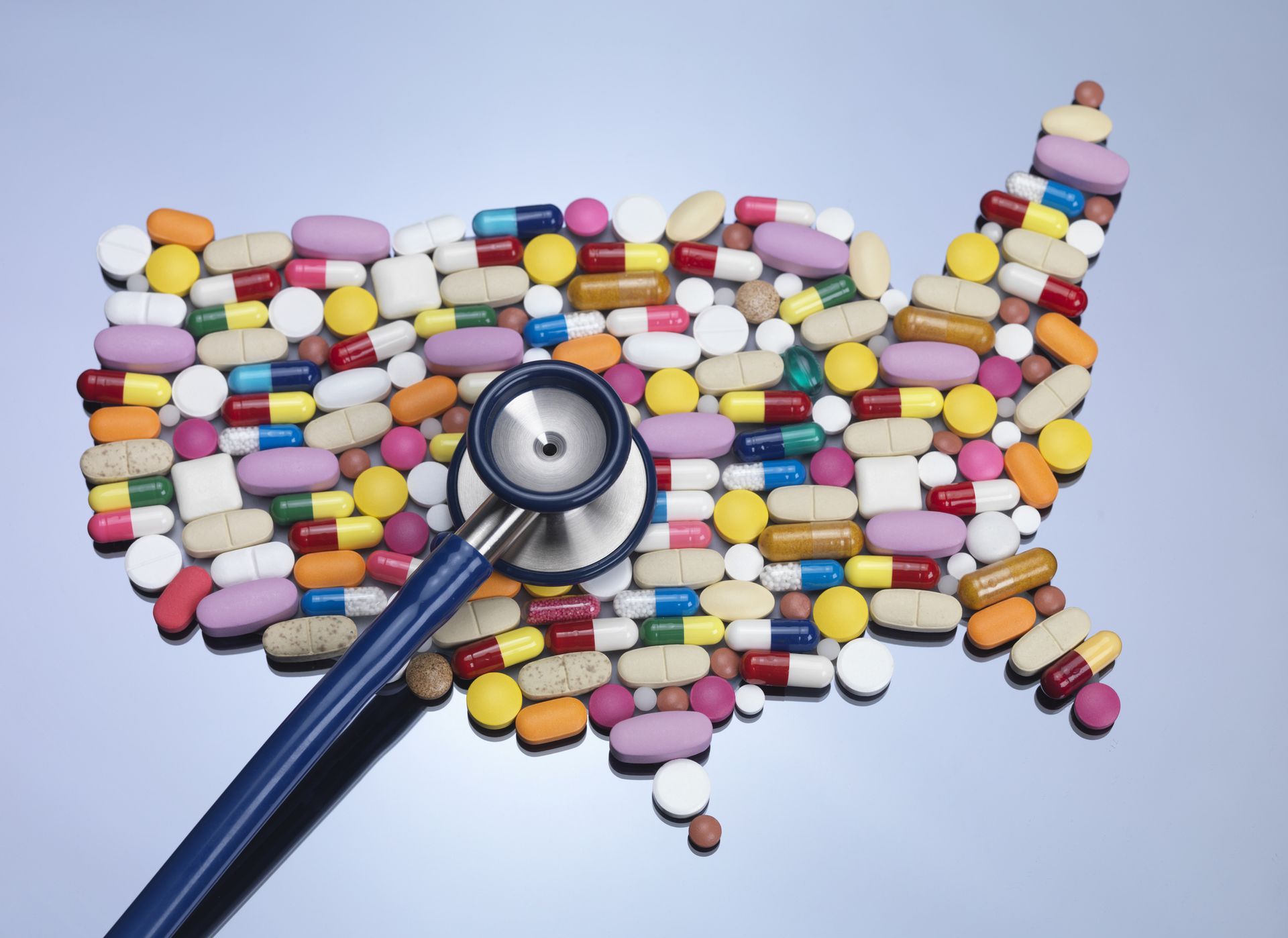 Map of United States of America made up of medicine with stethoscope.