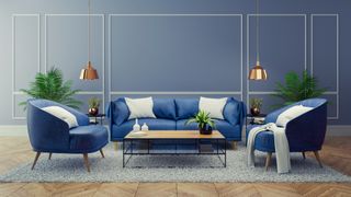 blue living room with blue sofa and white cushions