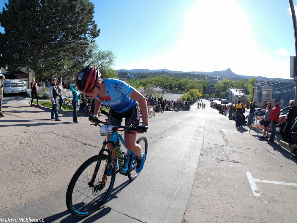 Alison Arensman riding the long climb out of Prescott center