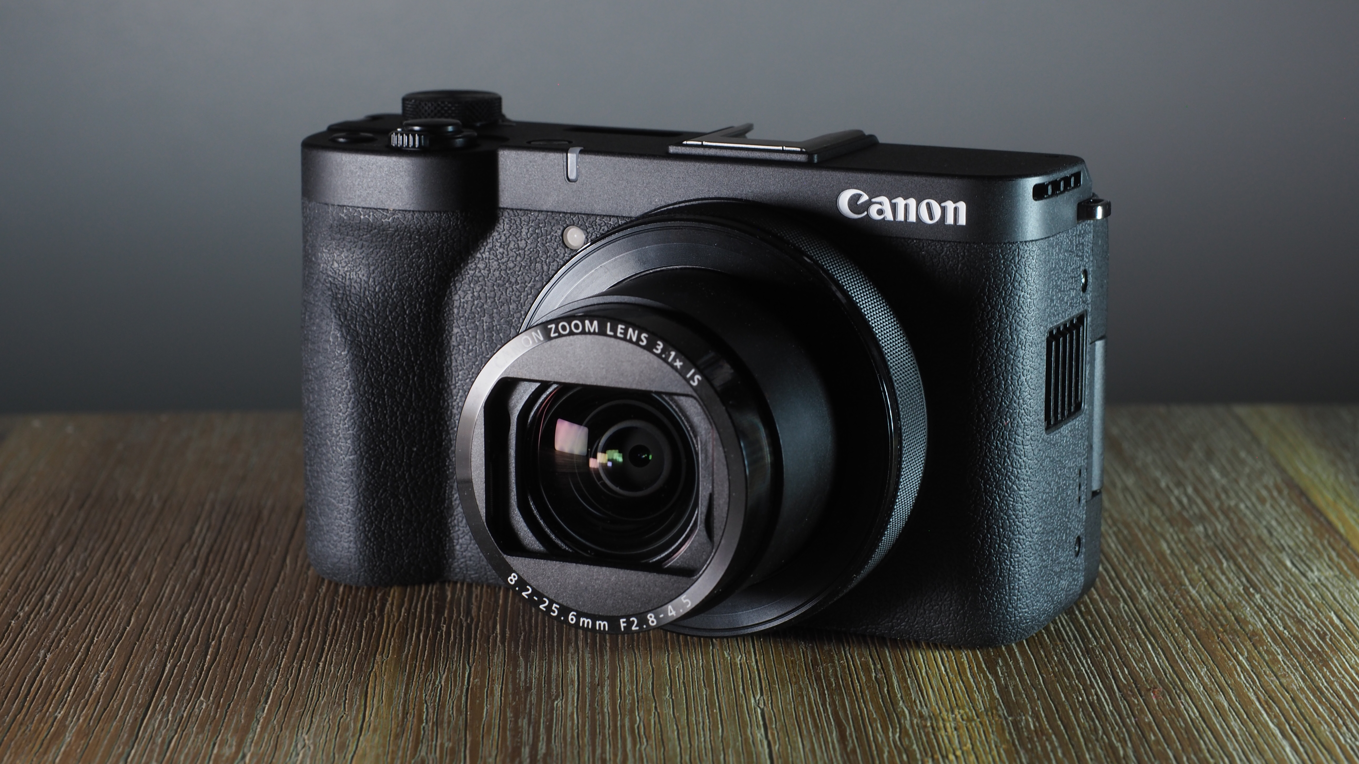 Canon PowerShot V1 on a wooden surface