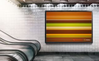 A McDonald's billboard ad featuring horizontal lines using the colours of a Big Mac to create the impression of it moving at speed