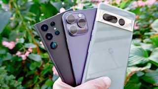 photo of pixel 7 pro, iphone 14 pro max, and galaxy s22 ultra in had