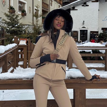 Emmanuelle Koffi posing at a lodge after going skiing 