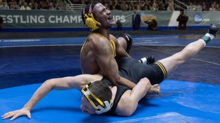 Anthony Robles (Jharrel Jerome) pins his wrestling opponent to the mat in Unstoppable