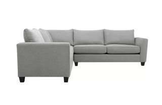 A grey upholstered corner sofa