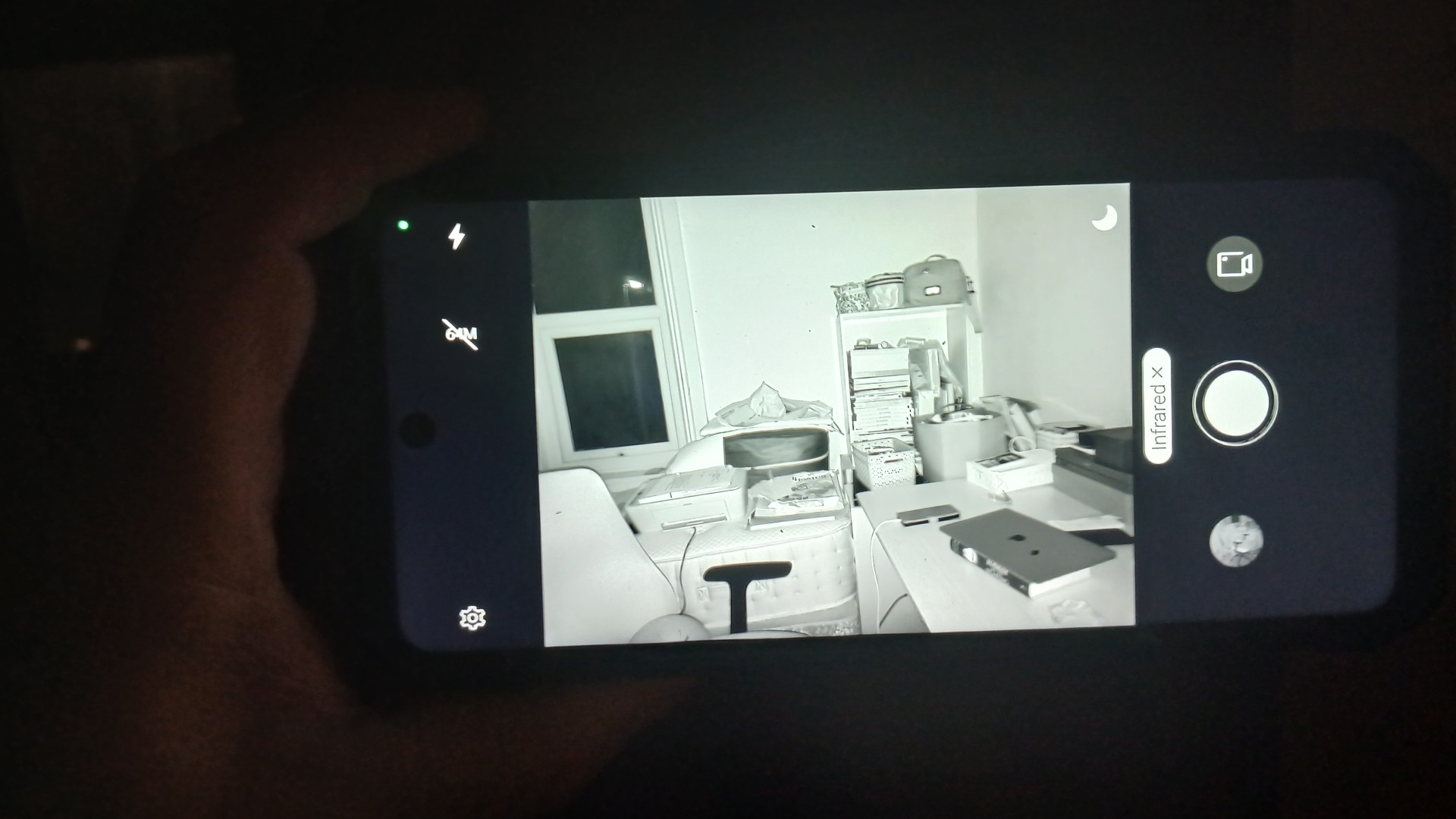 Phone screen capturing an infrared image in a pitch black room