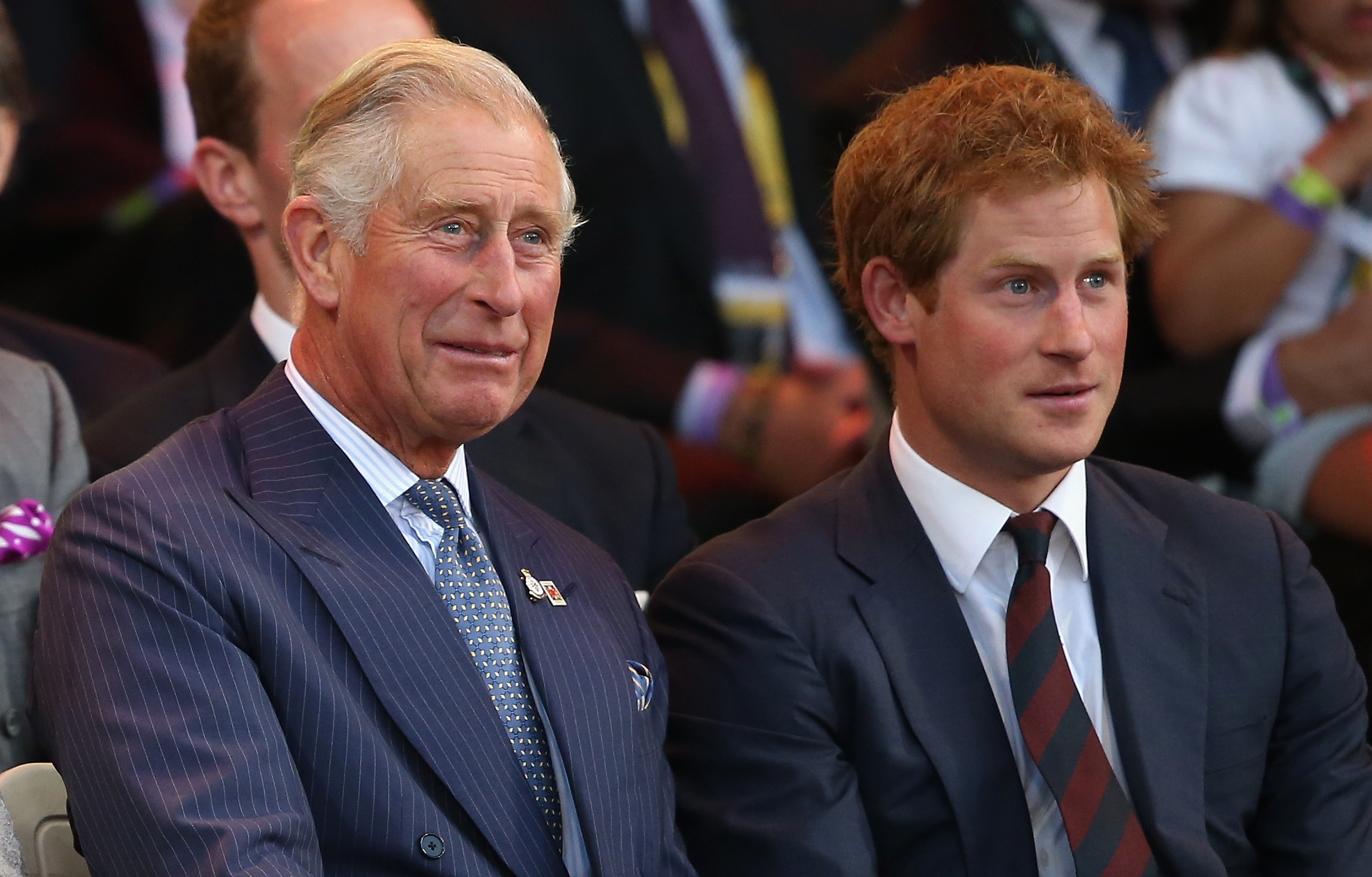 King Charles and Prince Harry look on during the Invictus Games Opening Ceremony on September 10, 2014