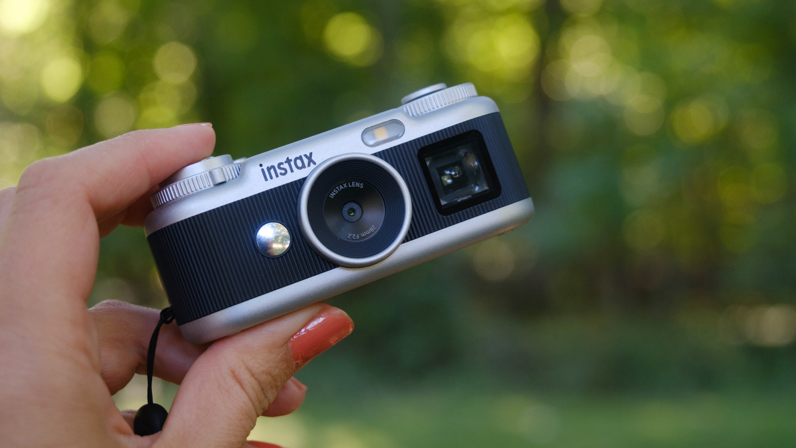 The Instax Pal 2 held in a photographer's hands