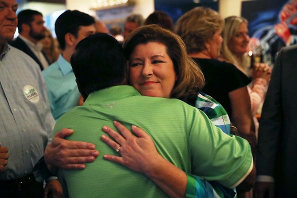 Karen Handel hugs a friend.