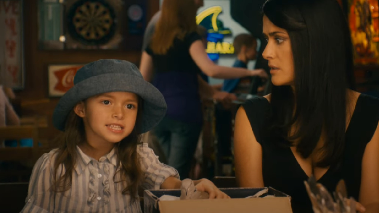 One of the children sitting at a table in Grown Ups.