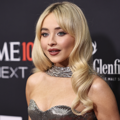 Sabrina Carpenter attends the 2024 TIME100 Next at Current at Pier 59 on October 09, 2024 in New York City wearing a silver chainmail dress