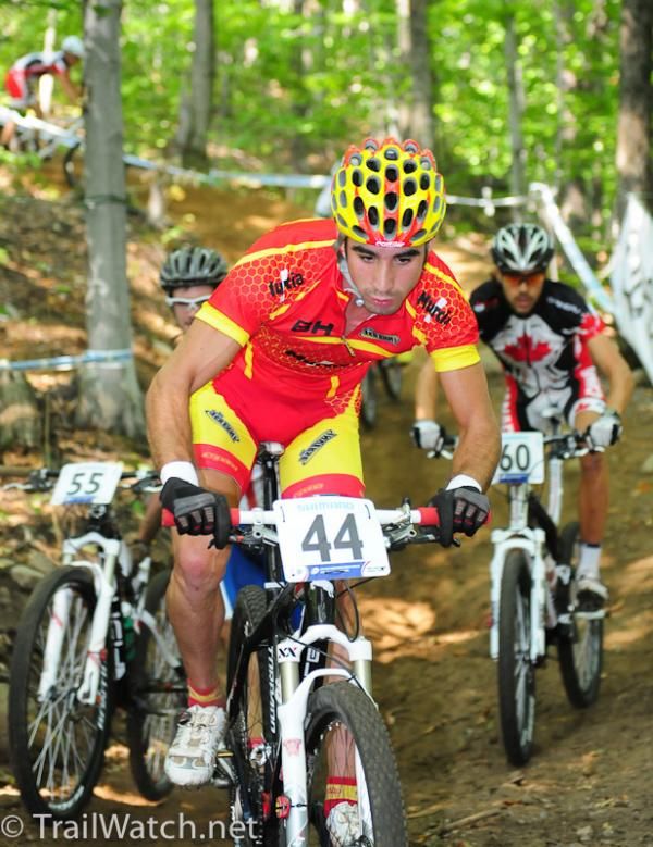 David Lozano Riba (Spain) passes a rider on foot