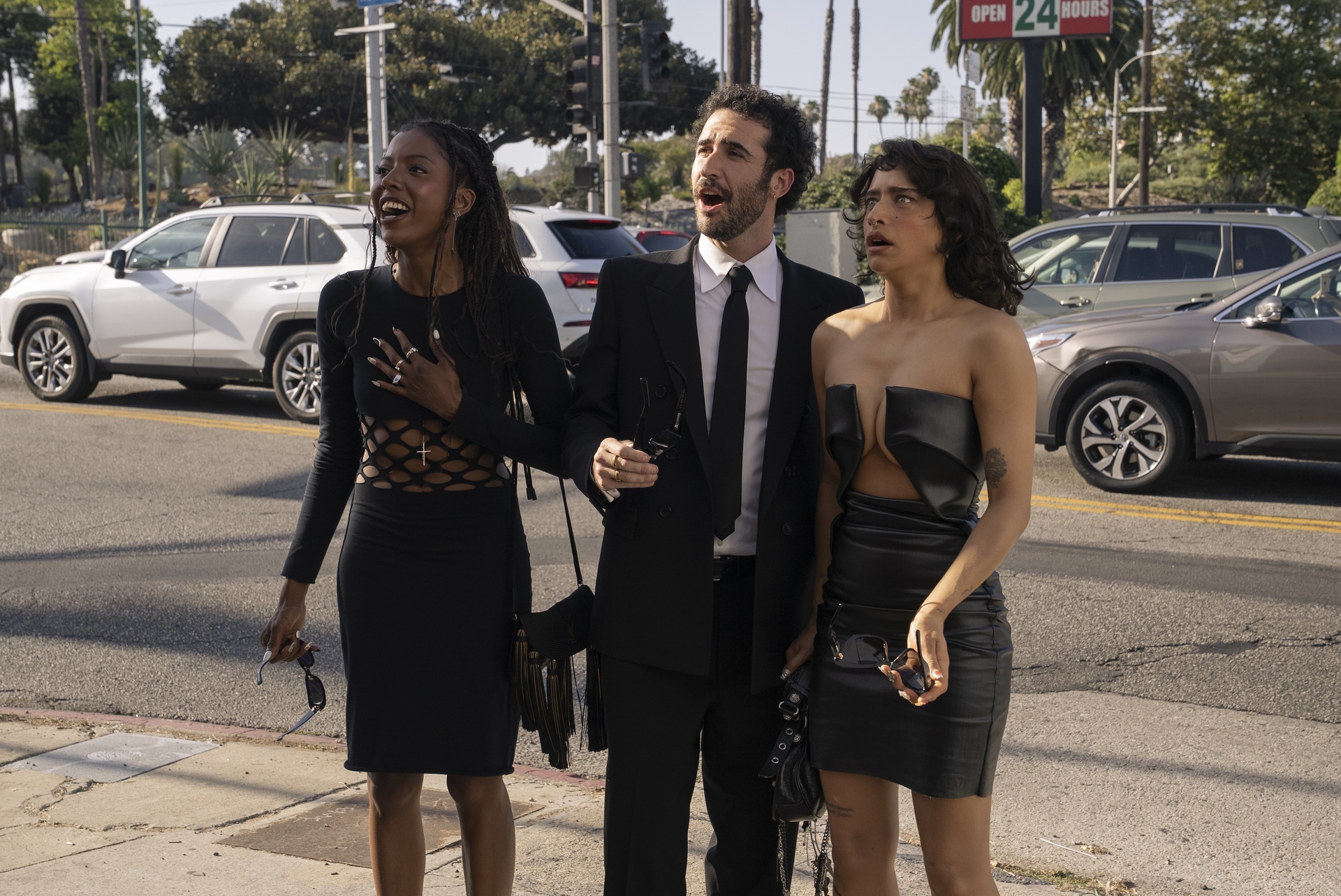 true whitaker as alani jordan firstman as charlie and odessa azion as tallulah look surprised on a busy los angeles street in i love la season 1
