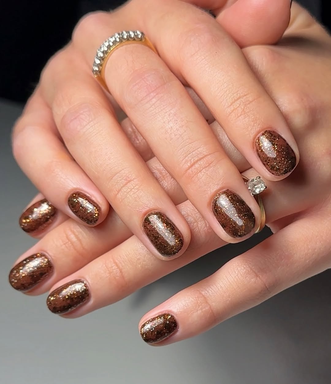 a shimmery brown manicure