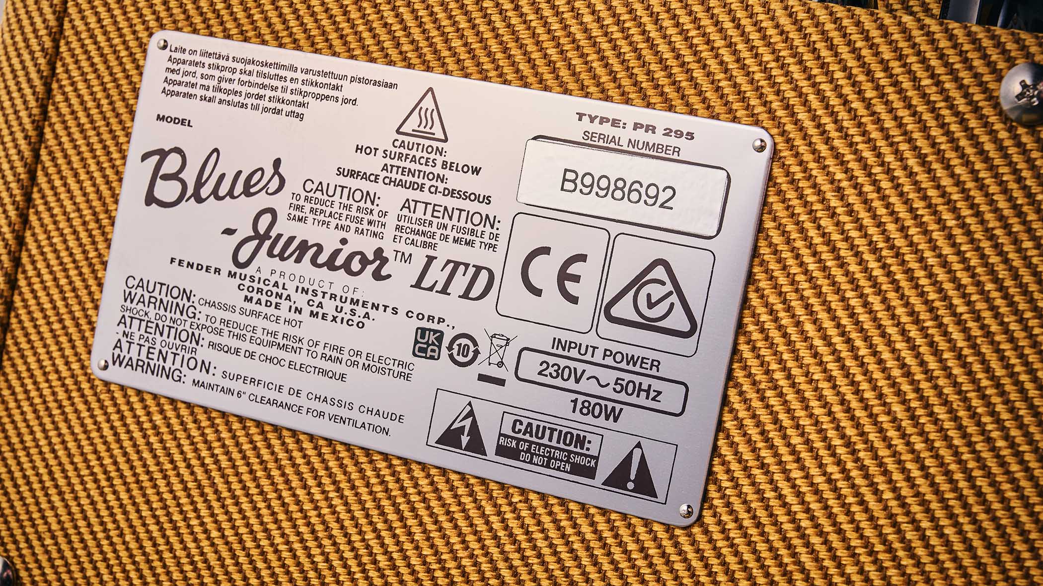 Close-up of the tweed Fender Blues Junior nameplate.