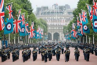 The band of the Royal Air Force parades on the Mall, which is bedecked with RAF ensigns, towards Buckingham Palace on July 10, 2018 during celebrations to mark its centenary. - The Queen and members of the royal family took part a series of engagements on July 10 to mark the centenary of the Royal Air Force. (Photo by Tolga AKMEN / AFP) (Photo credit should read TOLGA AKMEN/AFP/Getty Images)