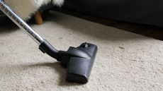 Vacuum cleaner on carpet floor
