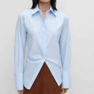 Flat lay image of woman wearing blue shirt