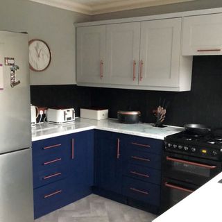 budget painted kitchen with marble-effect worktops