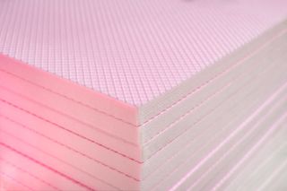 A stack of pink XPS insulation