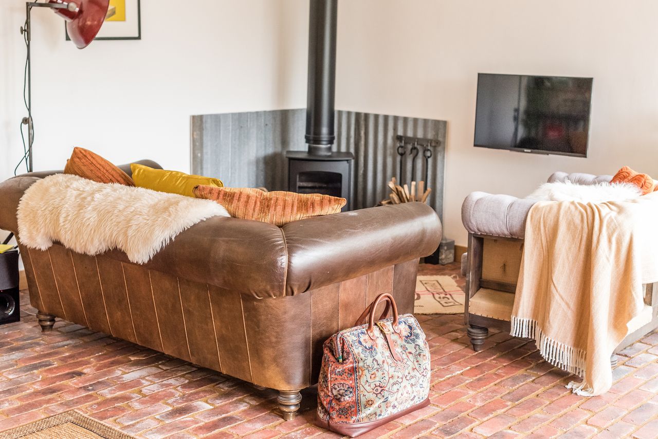 log burning stove in small house living area