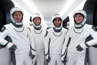The four astronauts of SpaceX's Crew-3 mission to the International Space Station for NASA pose for a photo on the gantry to their Crew Dragon Endurance during a launch rehearsal. They are (from left): ESA astronaut Matthias Maurer, NASA astronauts Tom Marshburn, Raja Chari and Kayla Barron.