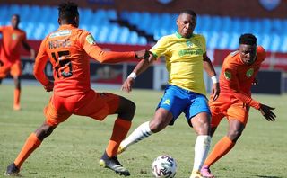 Andile Jali of Mamelodi Sundowns challenged by Nico Ngobe of Polokwane City