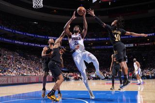 Joel Embiid #21 of the Philadelphia 76ers drives to the basket during the game against the Cleveland Cavaliers 
