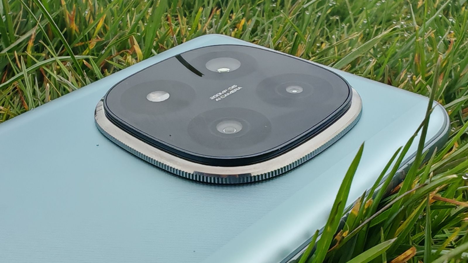 Xiaomi Redmi Note 14 Pro Plus 5G phone in hand and on grass showing homescreens and cameras up close