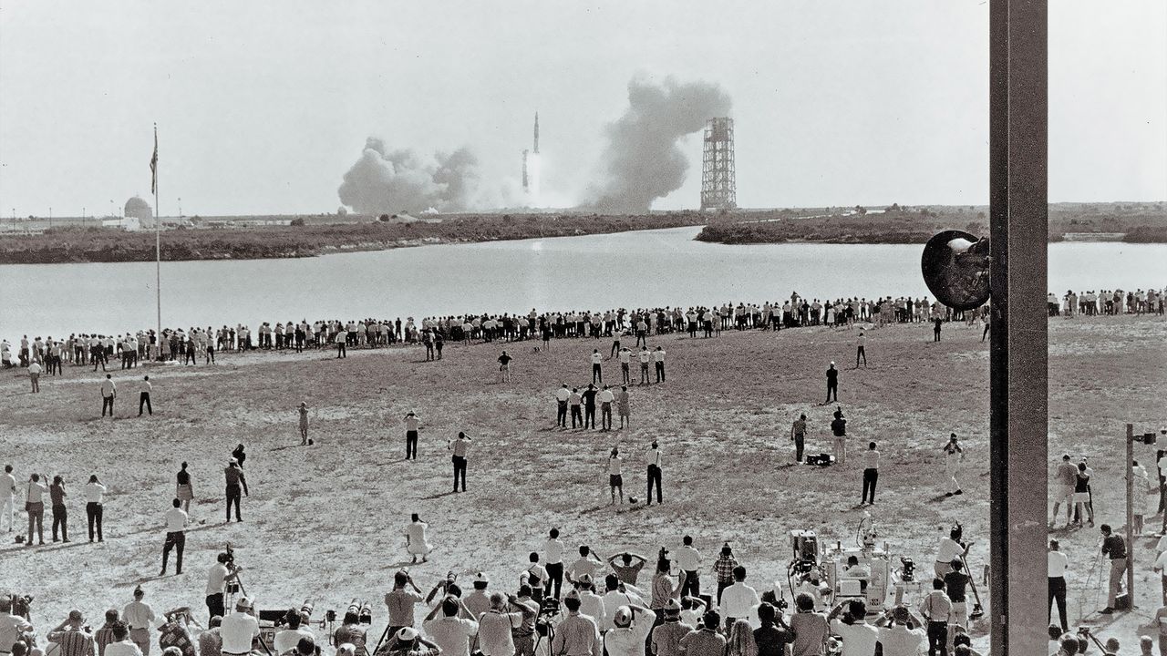 Spectators watch the Apollo 11 mission launch from Florida on July 16, 1969.