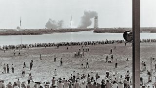 Spectators watch the Apollo 11 mission launch from Florida on July 16, 1969.