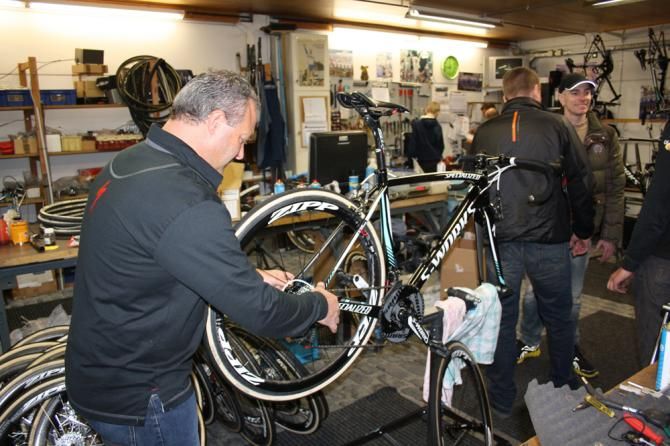 A team mechanic strips down one of the bikes from Gent-Wevelgem