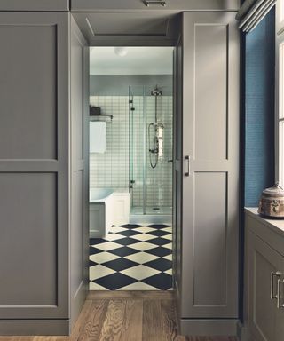 Bathroom with black and white checker board floor tiles